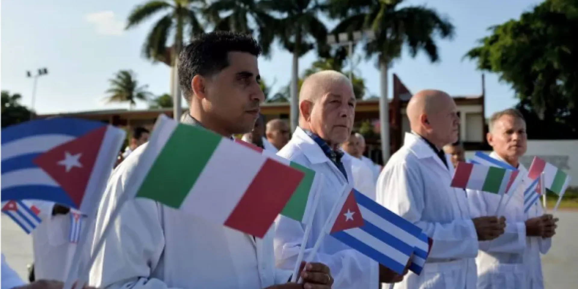 Doctors and nurses of Cuba's Henry Reeve International Medical Brigade are bid farewell before they travel to hard-hit Italy to help in the fight against the coronavirus COVID-19 pandemic, at the Central Unit of Medical Cooperation in Havana, on March 21. Cuba has dispatched medical personnel to dozens of countries around the world in hopes of helping to ease a global crisis that has already killed nearly 20,000 people around the world.